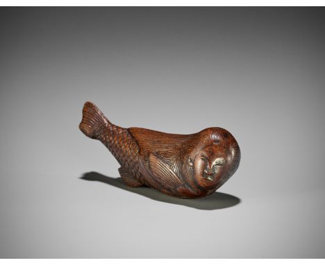 AN UNUSUAL WOOD NETSUKE OF A SWIMMING NINGYO (MERMAID)UnsignedJapan, late 18th to early 19th century, Edo period (1615-1868)B