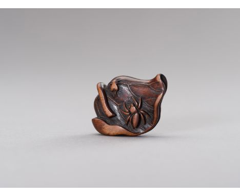 A BOXWOOD NETSUKE OF A LOTUS LEAFJapan, Edo period (1615-1868)The delicately carved boxwood netsuke in the shape of a lotus l