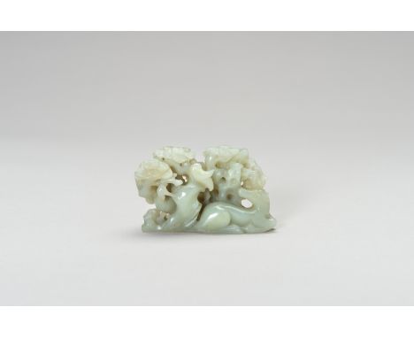 A 'CRANE AND DEER' CELADON JADE BRUSH RESTChina, late Qing Dynasty (1644-1912) to Republic period (1912- 1949). Carved with o