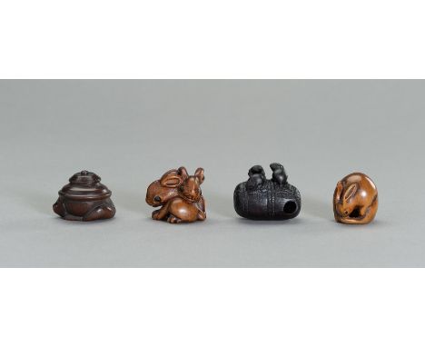 A GROUP OF FOUR WOOD NETSUKE OF ANIMALSJapan, 19th to early 20th centuryThe first depicting a tanuki tea kettle from the famo
