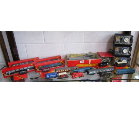 Shelf of Hornby 00 gauge locomotives, carriages etc