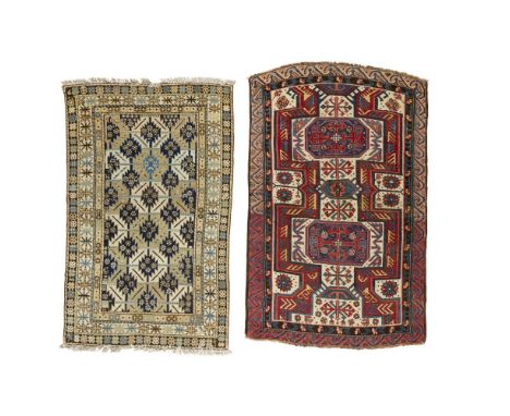 TWO KUBA RUGSEAST CAUCASUS, LATE 19TH/EARLY 20TH CENTURY the first with ivory field with two indigo octagonal medallions, wit