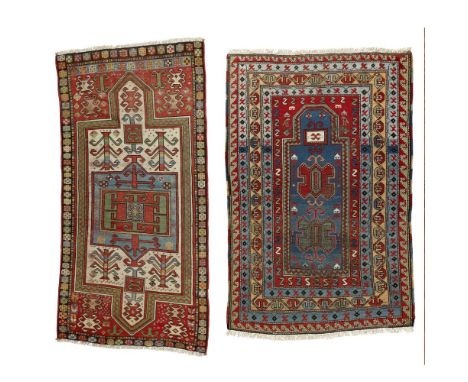 TWO KAZAK PRAYER RUGSSOUTH CAUCASUS, LATE 19TH/EARLY 20TH CENTURY the first with blue mihrab within multiple borders; the sec