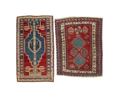 TWO KAZAK RUGSSOUTH CAUCASUS, LATE 19TH/EARLY 20TH CENTURY the first a Bordjalou with red field with two blue lozenge medalli