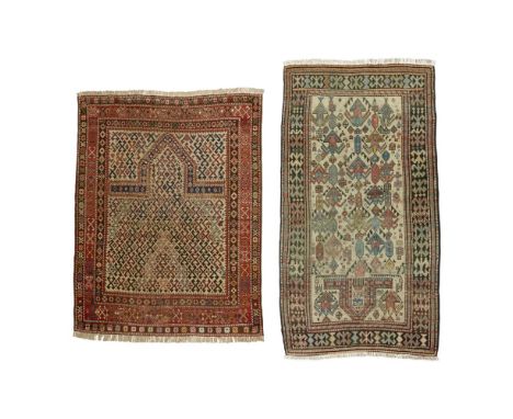 TWO SHIRVAN PRAYER RUGSEAST CAUCASUS, LATE 19TH/EARLY 20TH CENTURY the first with ivory field with allover hooked X pattern, 