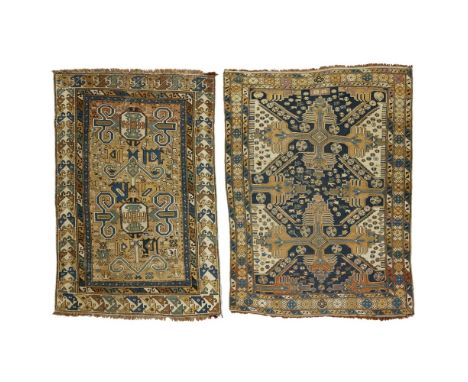TWO SHIRVAN RUGSEAST CAUCASUS, LATE 19TH/EARLY 20TH CENTURY the first with camel field with Perepedil pattern, within ivory h