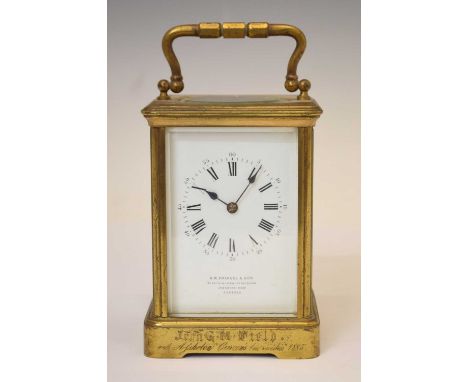 Late 19th century brass carriage clock, the white enamel dial with Roman hour markers and blued steel spade hands, retailed b