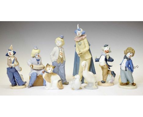 Quantity of Nao porcelain clowns, cat and two geese, together with two Nadal porcelain clowns, 30cm high and smaller (9)
