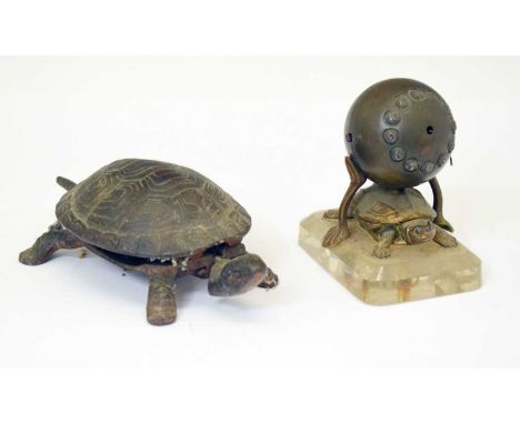 Early 20th century gilt metal metal turtle desk clock, the spherical clock with cellular Arabic dial, mounted on glass base, 