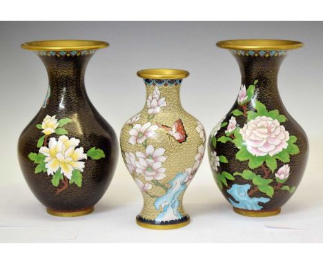 Pair of Chinese cloisonné enamel vases, the black ground with gilt and floral decoration, 27cm high, together with a cream gr