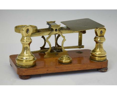 Early 20th century set of brass and oak letter scales with weights, 20cm wide