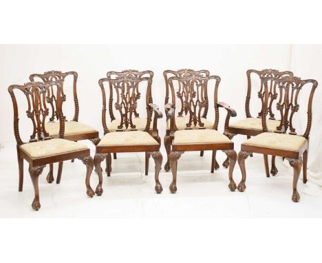 Set of eight mahogany Chippendale style dining chairs, each with floral tapestry drop-in seats, raised on carved cabriole fro