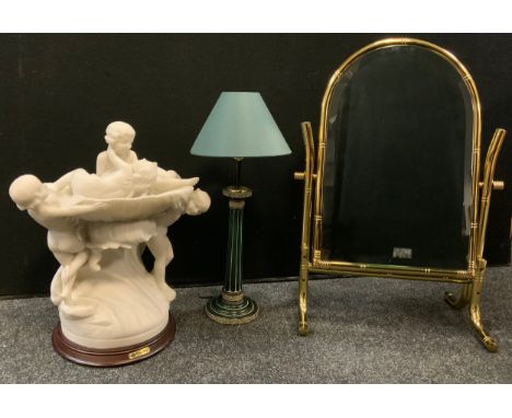 A modern brass bamboo effect dressing mirror, 64cm high;  a resin marble effect figural lamp, Chou Ming;  a side light (3) 