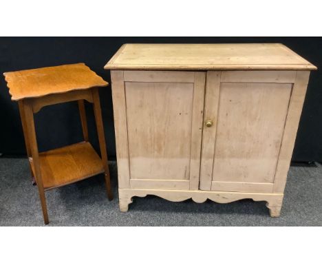 A Victorian pine cupboard, rounded rectangular top, pair of panelled doors enclosing shelving, shaped apron, bracket feet, 88