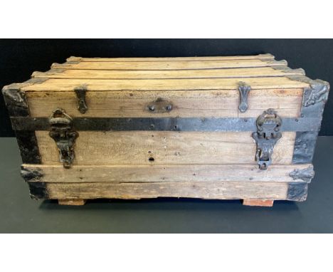 A 20th century pine metal bound trunk, 35cm high, 73cm wide, 45cm deep. 