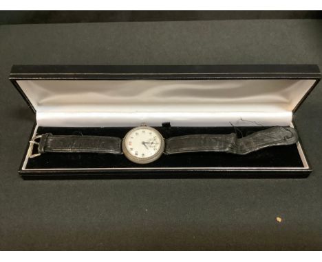 An early 20th century Swiss silver wristwatch, screw cap case with white enamel dial, Arabic numerals, minute track, subsidia