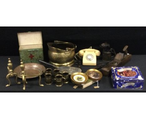 A retro 746 EET 79/2 cream cradle telephone;  first aid tin;  brass andirons,  coal scuttle, tools etc 