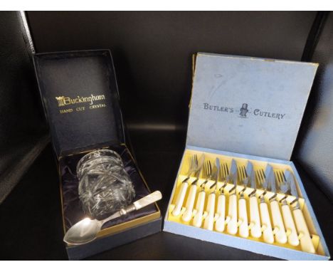 A boxed Buckingham hand cut crystal preserve pot with a silver plated M.O.P handle spoon, plus a boxed 'Butler's Cutlery' fis