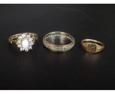 3 x 9ct gold rings - 2 are gold and silver one with a white opal - size L, and a childs signet ring size E. 5.21g total lot w