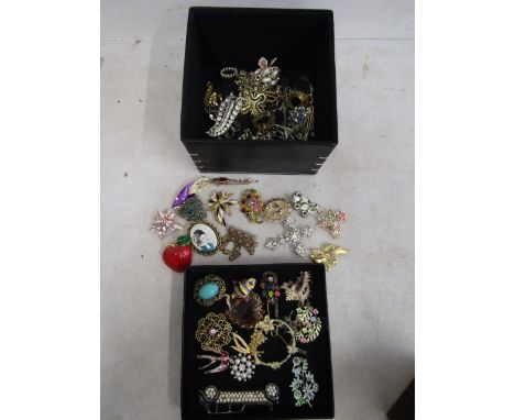 vintage brooches in black box