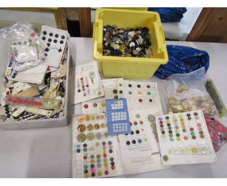 Collection of vintage buttons in 2 tubs, one tub has many on cards