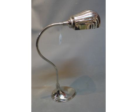 A nickel plated Art Deco style desk lamp with shell shape shade. 