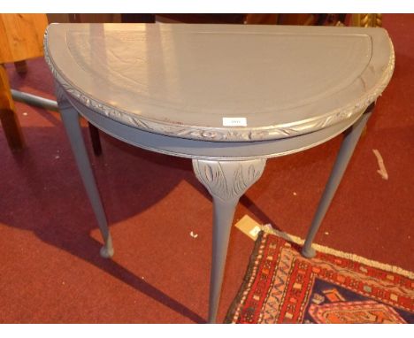 A grey painted demi lune console table