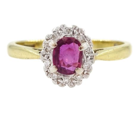 18ct gold oval cut ruby and diamond cluster ring, hallmarkedCondition Report:Approx 2.65gm, size L, overall head = 8.5mm x 7.