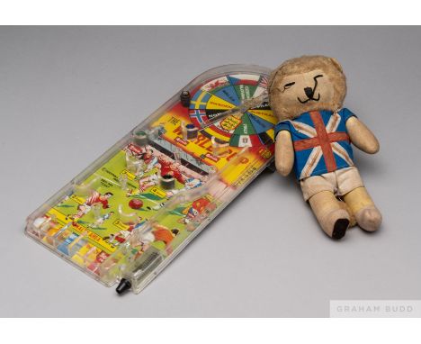 A 1966 World Cup Willie plush toy with a World Cup 1966 bagatelle game    Both are in good condition with the usual age relat