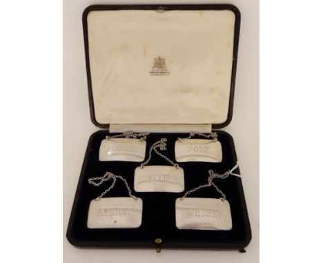 A cased set of five silver decanter labels by Atkin Brothers, Sheffield 1937, Brandy, Port, Gin, Sherry and whisky Condition 