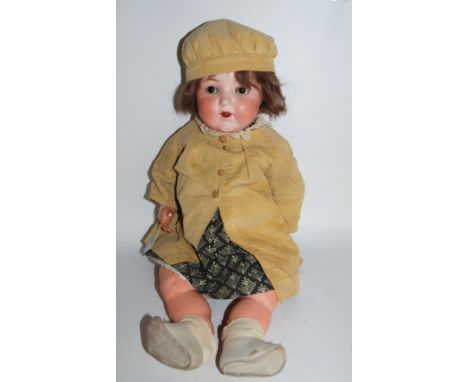 An Armand Marseille 995 bisque-headed doll with open and close brown eyes, open mouth and painted features with impressed fac