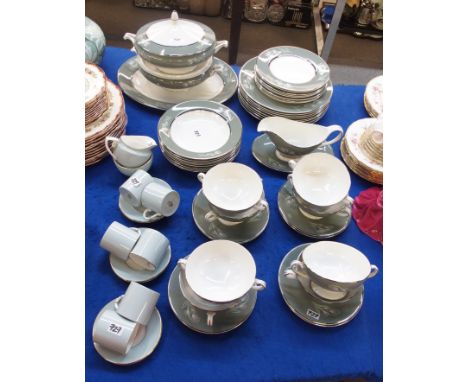 A Simpson's Haslemere pattern dinner service comprising dinner plates, side plates, pudding bowls, soup coups and saucers, sa