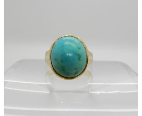 An 18ct gold turquoise set ring, size M, weight 6.3gms Condition Report:Medium general wear, bit of greening to the turquoise