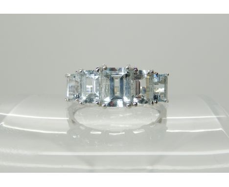 A 9ct white gold aquamarine five stone ring, size S1/2, 2.6gms Condition Report: A QVC (TV Channel) ring, aquas appear nice a