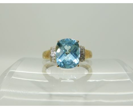 A 9ct gold checkerboard cut topaz and diamond accent ring, size P, weight 3gms Condition Report: Available upon request