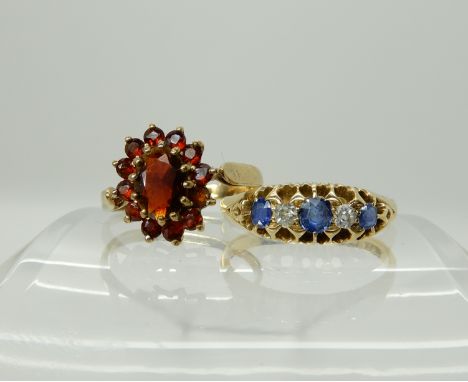 An 18ct gold sapphire and diamond ring size P, weight 3gms, together with a 9ct gold garnet cluster ring size M, weight 1.9gm