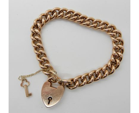 A 9ct gold curb link bracelet, with heart shaped clasp with key lock, length 18cm, weight 18.1gms Condition Report: Light gen