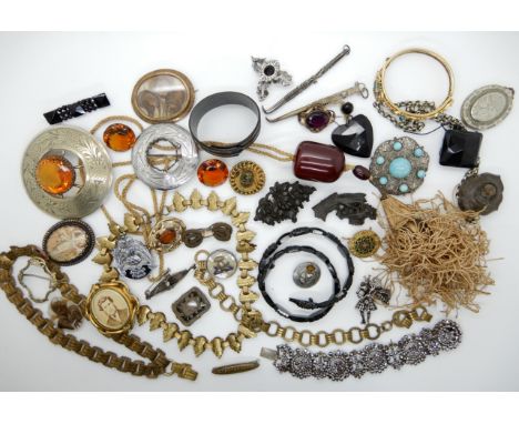A collection of Victorian and other vintage jewellery to include locket chains, jet snake necklace, steel cut work bracelet e