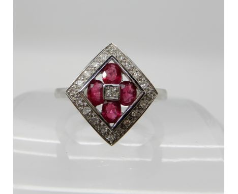 A 14k white gold ruby and diamond cluster ring, size P1/2, weight 4.2gms Condition Report: Available upon request