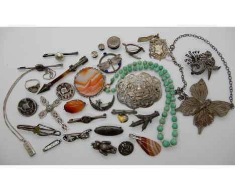 A silver Celtic cross, two girls association Viking longship brooches, a silver and enamel chick brooch and other items Condi