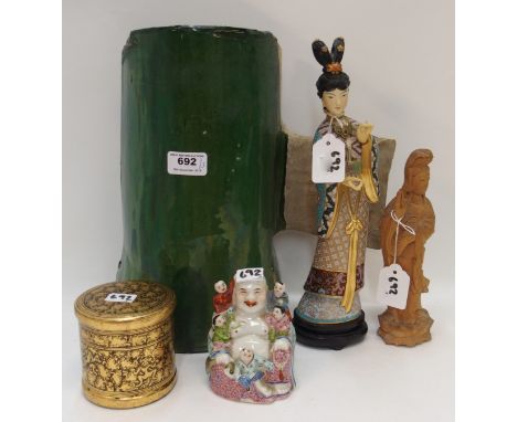 A Japanese cloisonne figure of a Geisha, a porcelain smiling Buddha, a lacquered box and cover, carved wood Guanyin and a gre