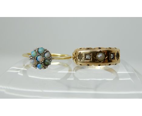 A 15ct gold and diamond ring, size L, weight 1.8gms, and an 18ct gold opal flower ring, size N, weight 2.3gms Condition Repor