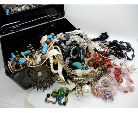 A box full of vintage costume jewellery Condition Report: Not available for this lot