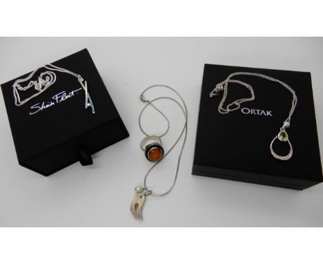 A silver Sheila Fleet enamel and Swarovski crystal pendant in box a Ortak peridot pendant, a silver and pearl bird pendant an