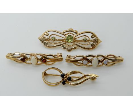 A 9ct gold peridot brooch, length 4.5cm, two 9ct opal set brooches and a 9ct sapphire example Condition Report: Available upo