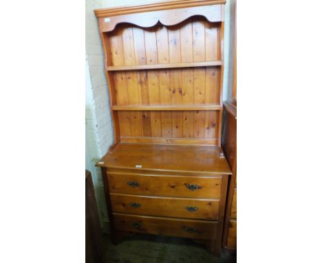 A modern stained pine shelf back dresser