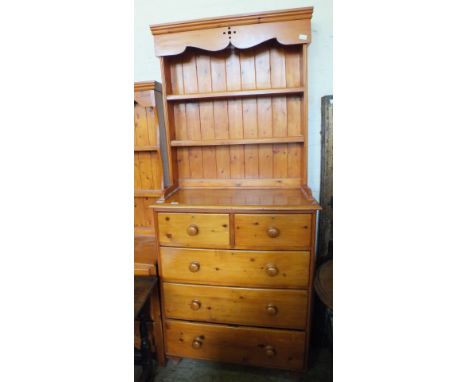 A Victorian pine chest of two short and three long drawers with later shelf back