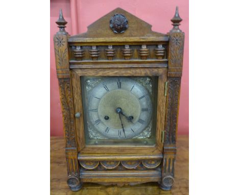 A 19th Century German T.H. carved oak mantel clock