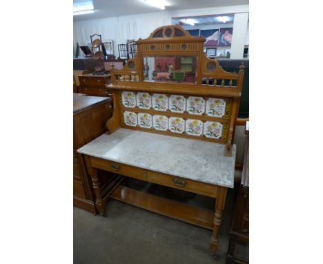 A Victorian satin birch, marble topped and tile back washstand