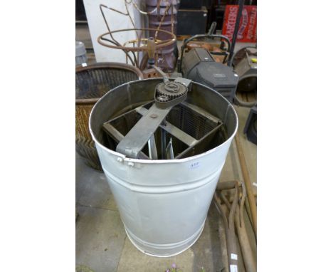 A vintage honey spinner
